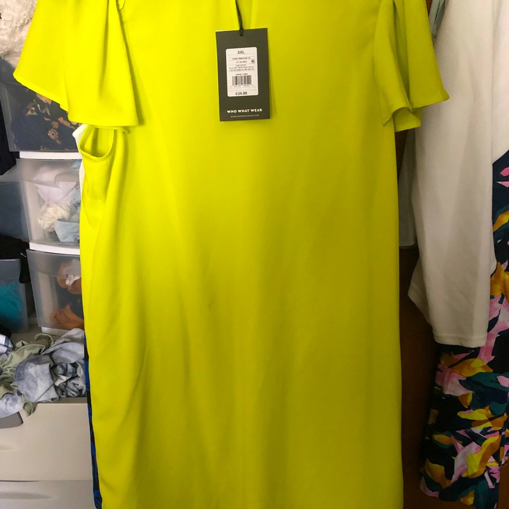 Short sleeved yellow dress. Knee length. Not worn.